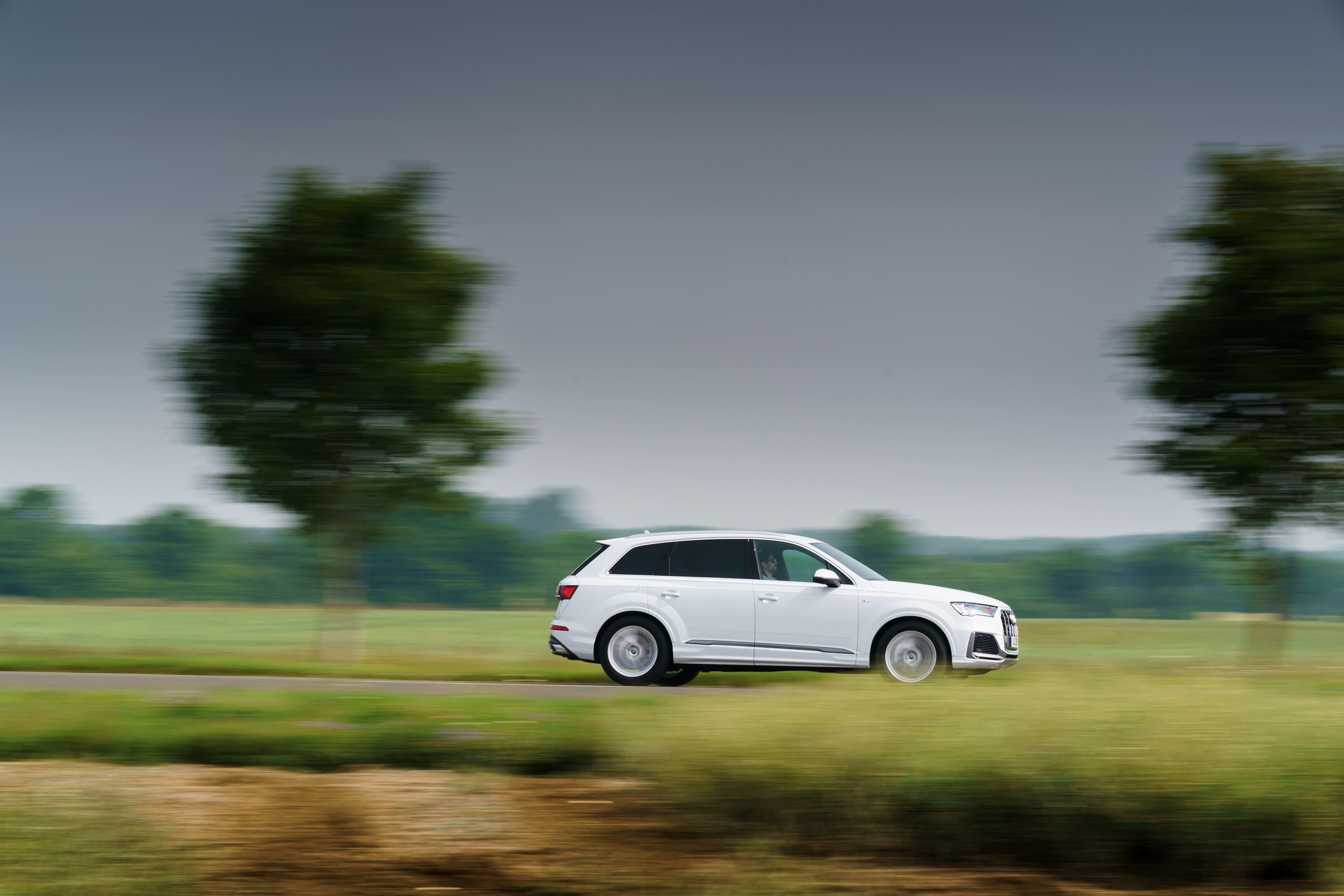 white Audi Q7 driving